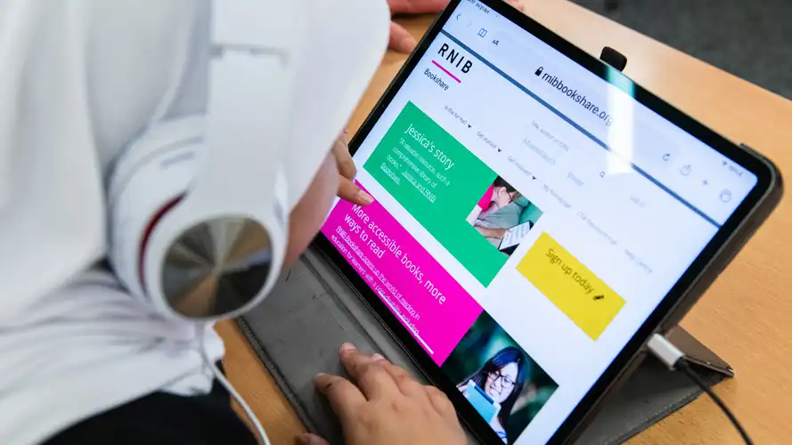 Student visiting the RNIB Bookshare library on a tablet